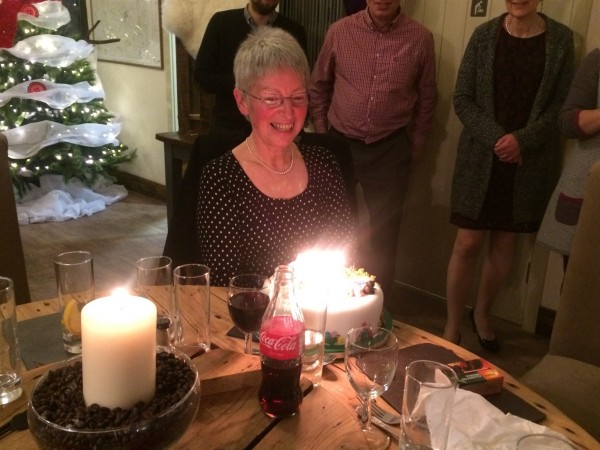 SPANA supporter Anne Yeeles celebrates her birthday by blowing our candles on a cake.