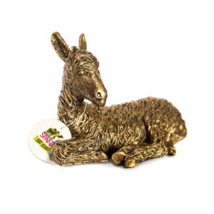 Bronze figuring depicting a donkey lying down with a SPANA centenary gift tag